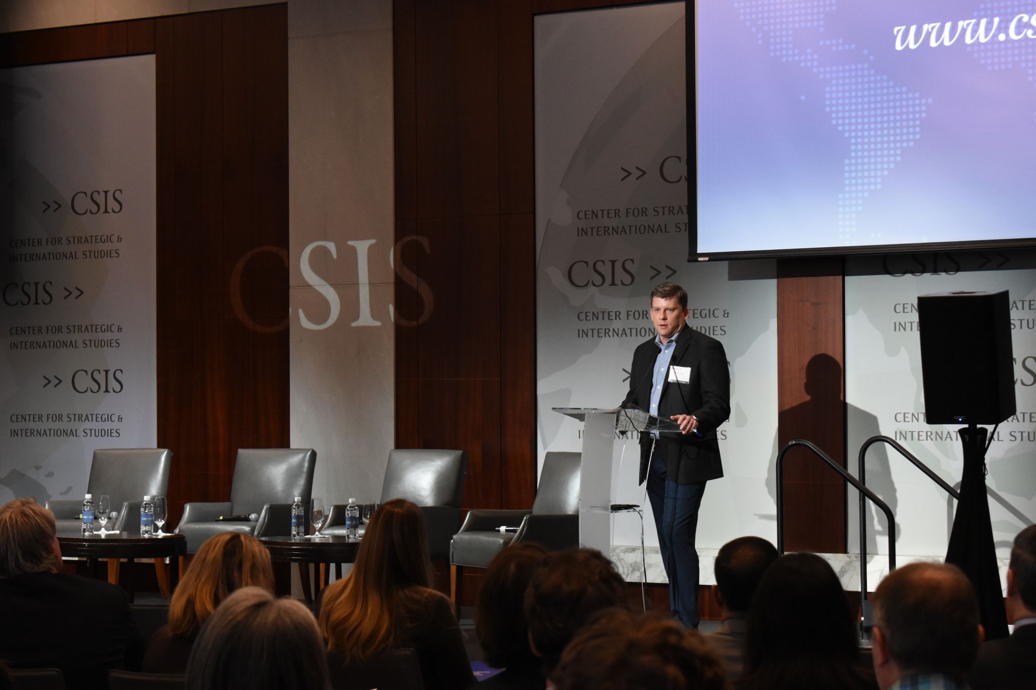 Ryan Powers speaking from the podium at CSIS